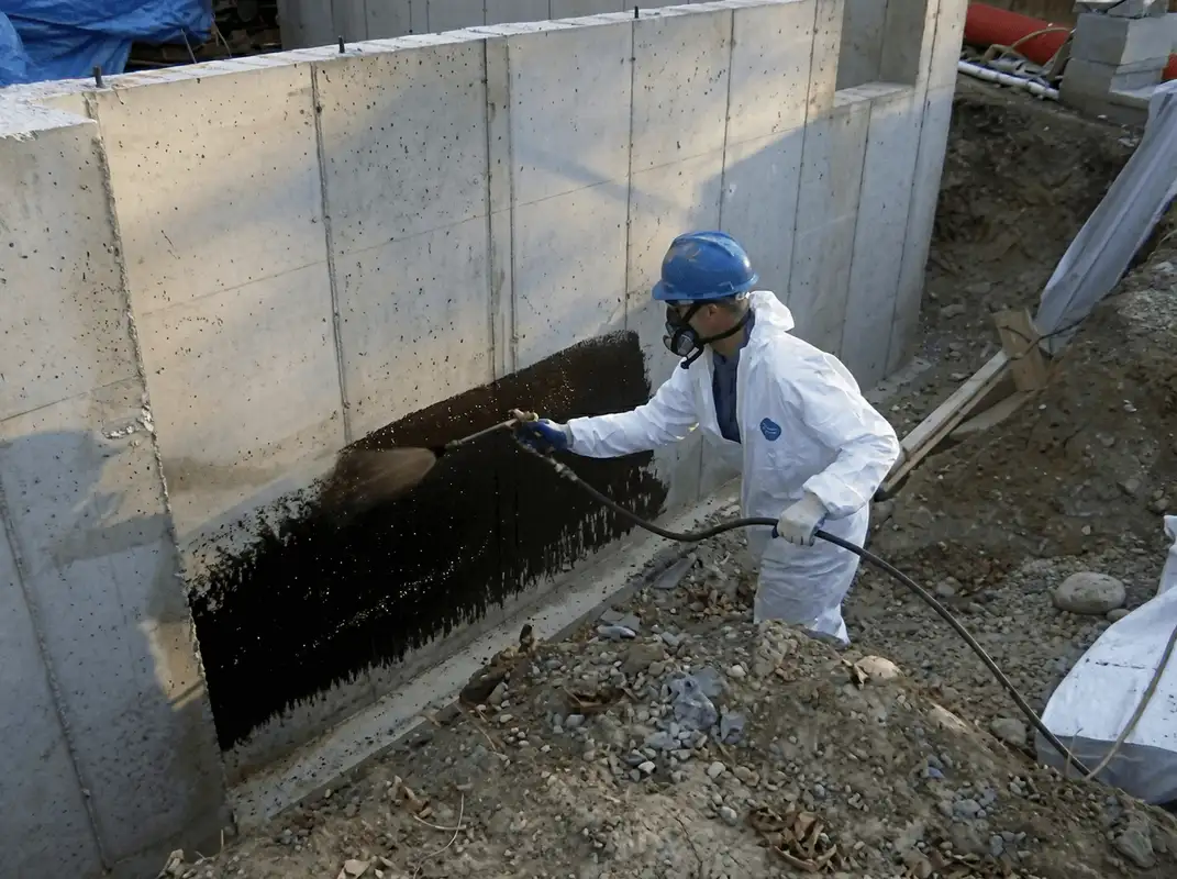 Professional waterproofing the exterior walls of the basement in Dallas, TX