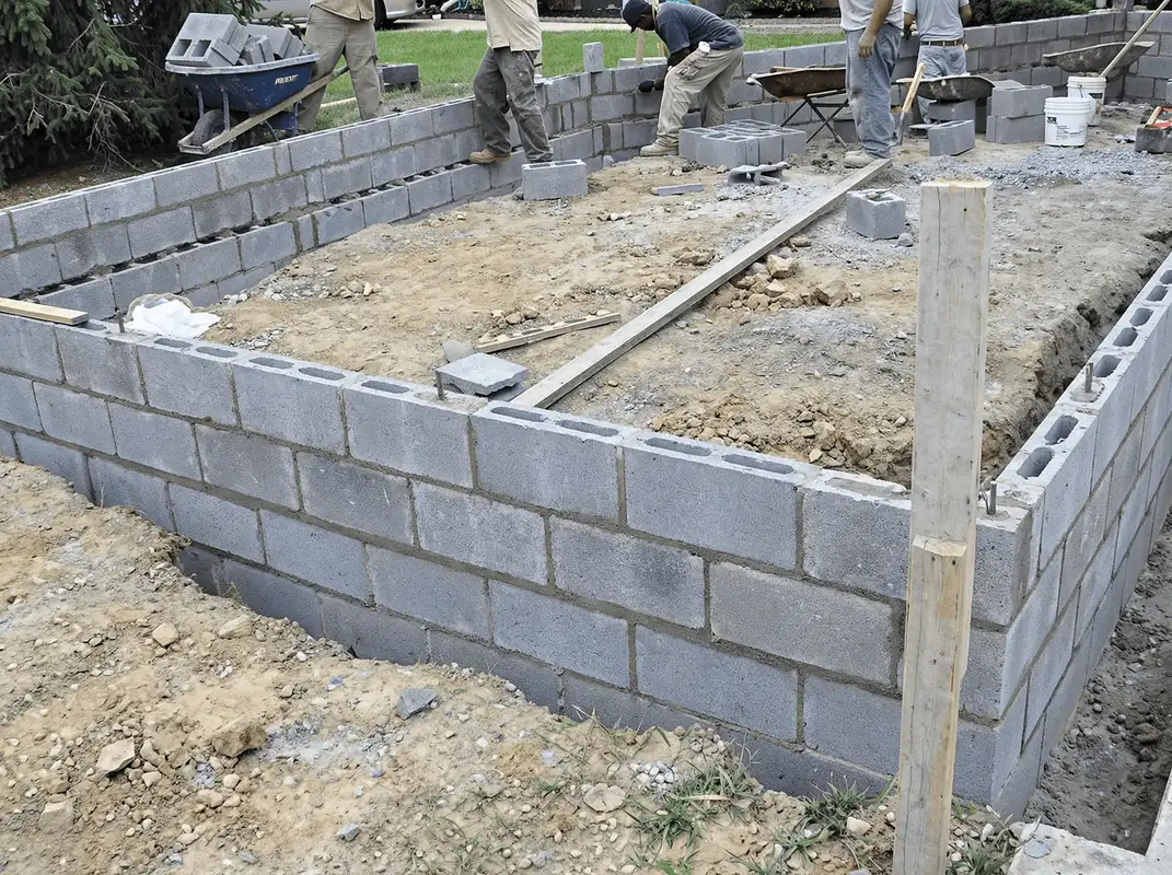 Professionals building a foundation with blocks in Dallas, TX