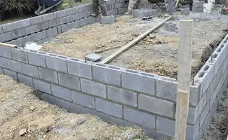 Professionals building a foundation with blocks in Dallas, TX