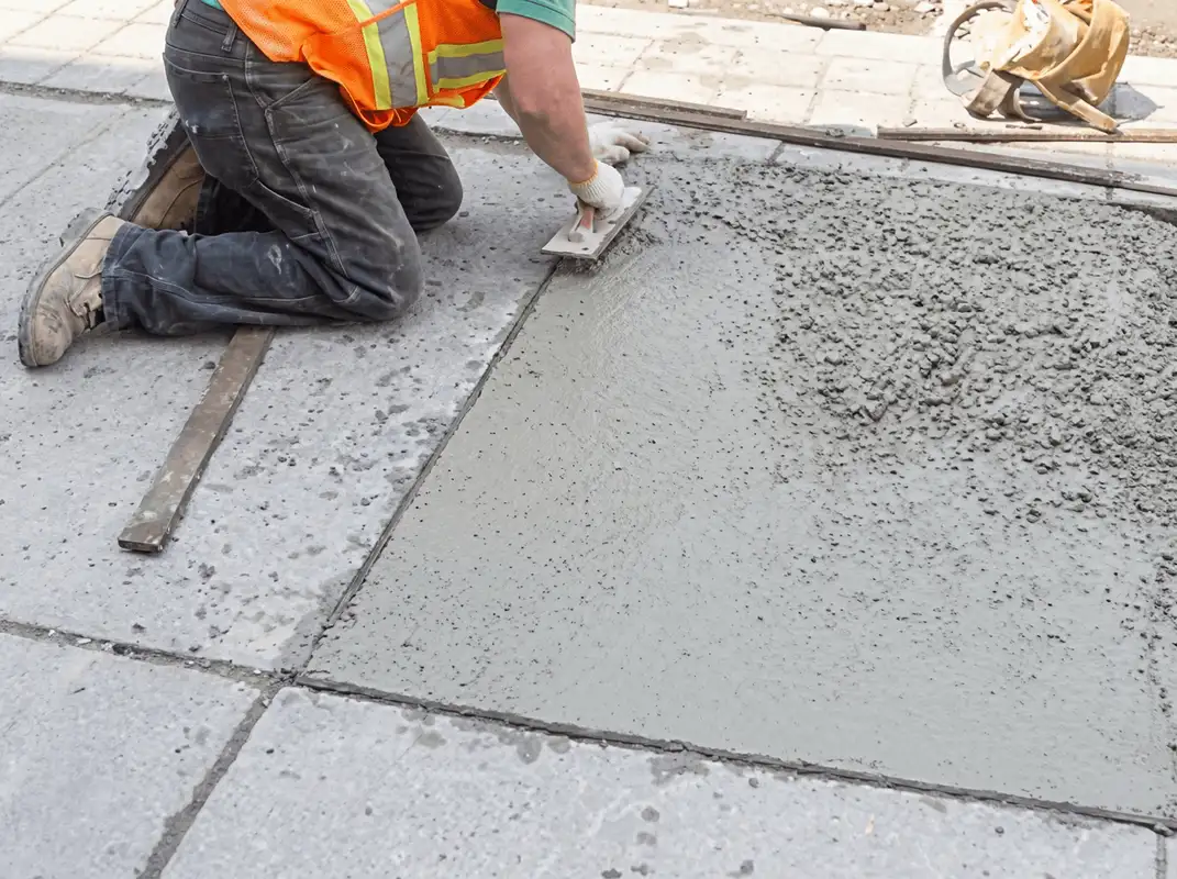 Professional repairing a concrete floor in Dallas, TX