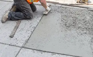 Professional repairing a concrete floor in Dallas, TX
